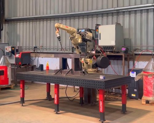 Robotic welding on cyclotron table Robotic welding on cyclotron table